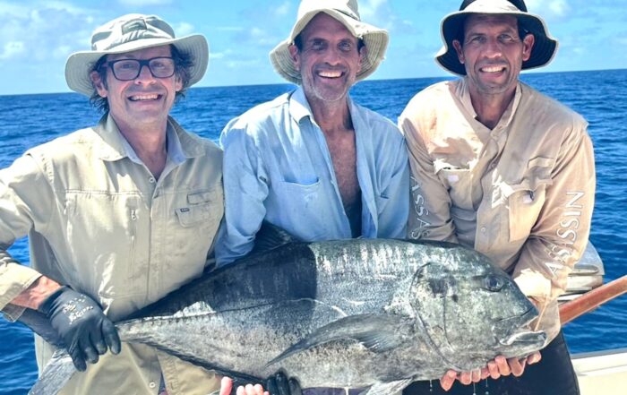 Anglers holding a large GT at African Banks Seychelles prior to release