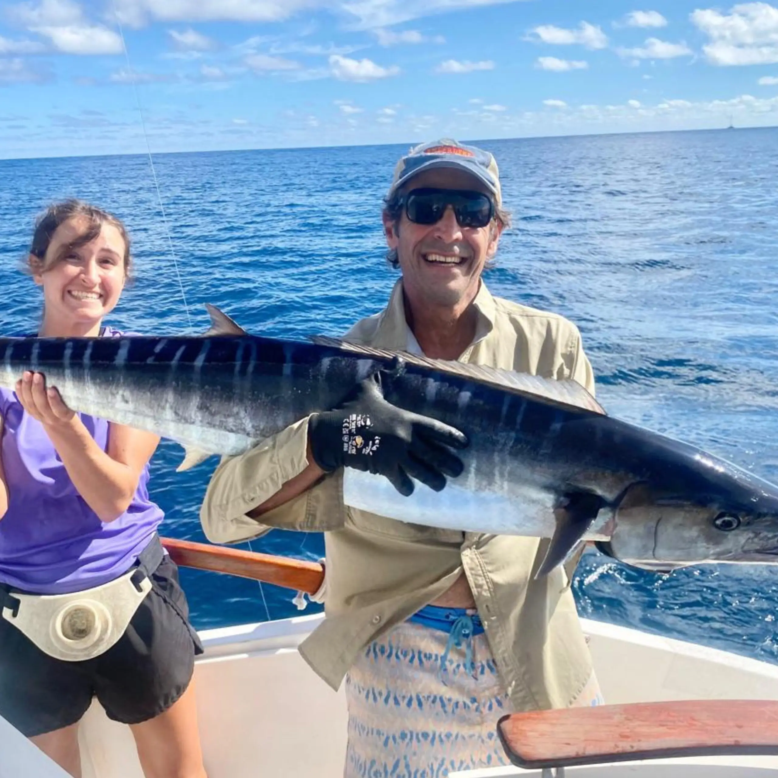 Anglers holding a wahoo at African Banks Seychelles before release