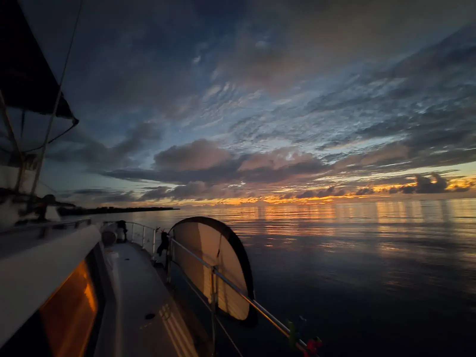Side view of an offshore fishing boat at sunset in Seychelles waters
