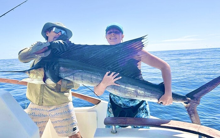 Aggressive Seychelles Sailfish charging a pink stickbait at African Banks